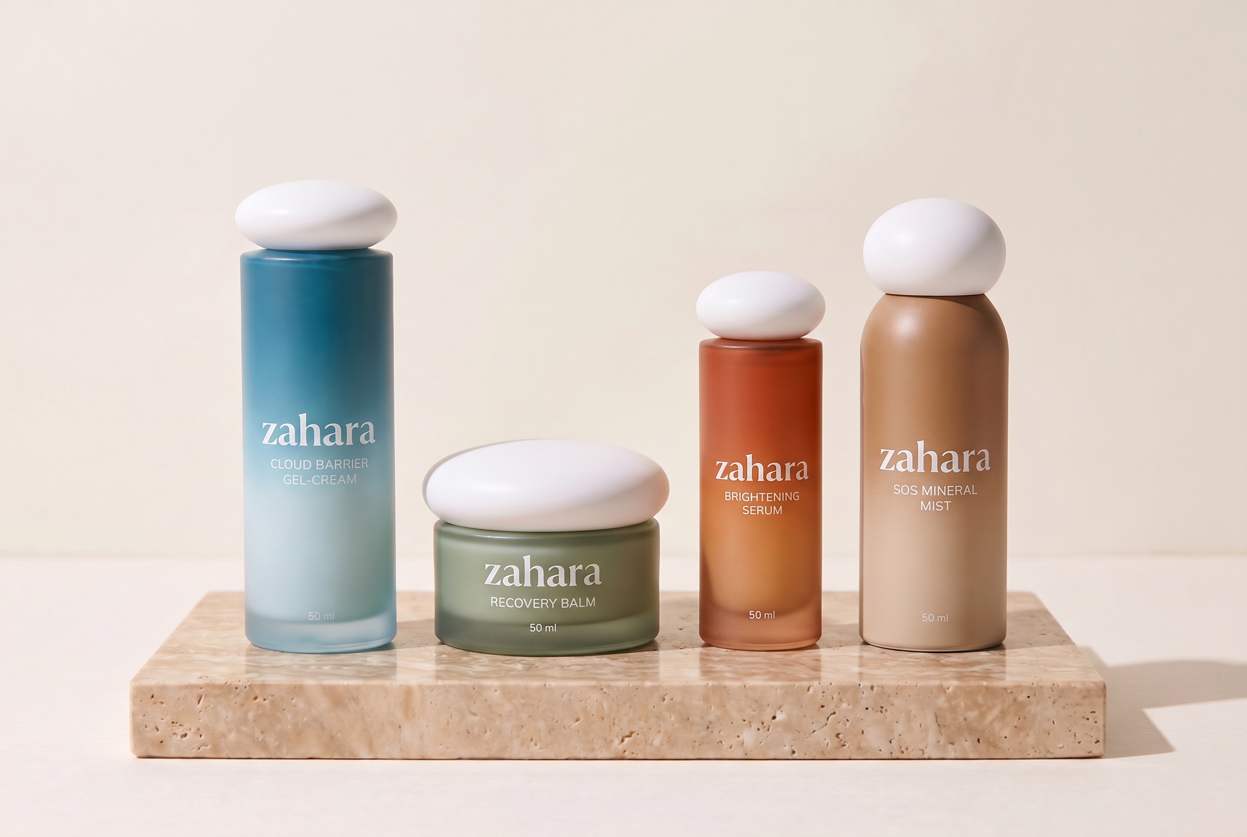 The Zahara product system: Recovery Balm jar, Cloud Barrier Gel-Cream bottle, and serum bottle on a warm ivory shelf in soft daylight.